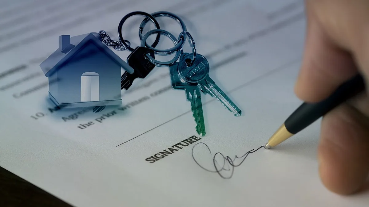 Budapest apartment interior with rental contract documents on a table